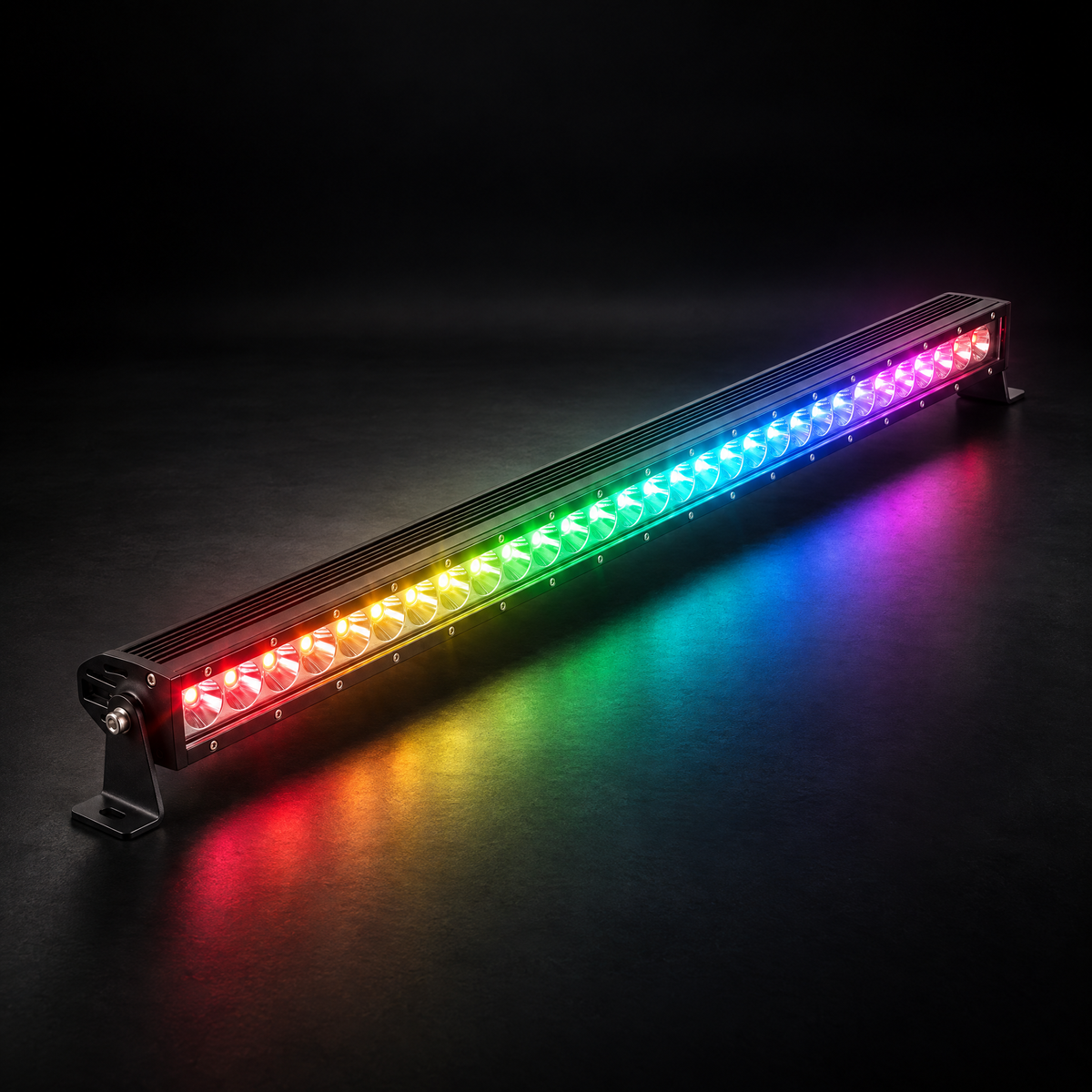 32 inch Whipped 4WD RGB LED light bar lit in chasing rainbow colours, casting coloured light onto a dark studio floor